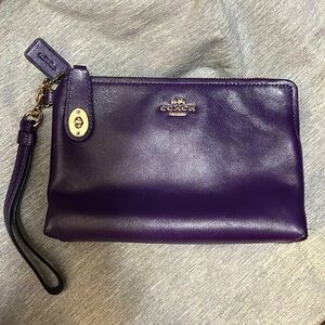 Coach purple wristlet with zipper and latch